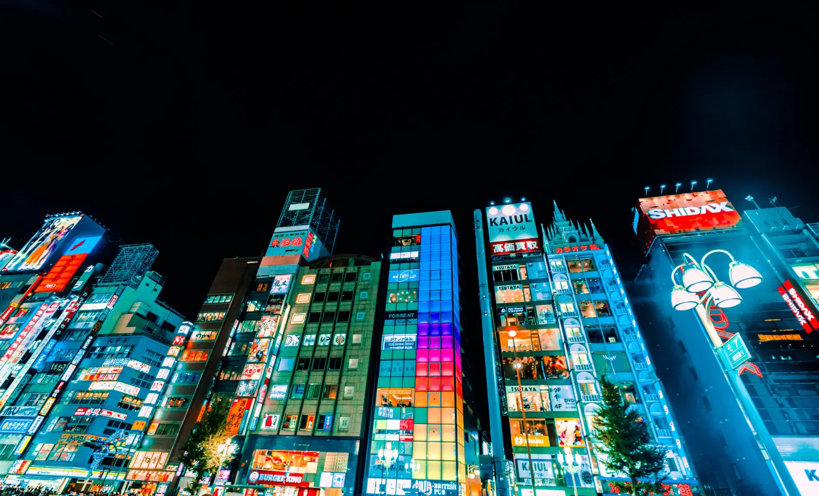 Neon-lit buildings against a night sky